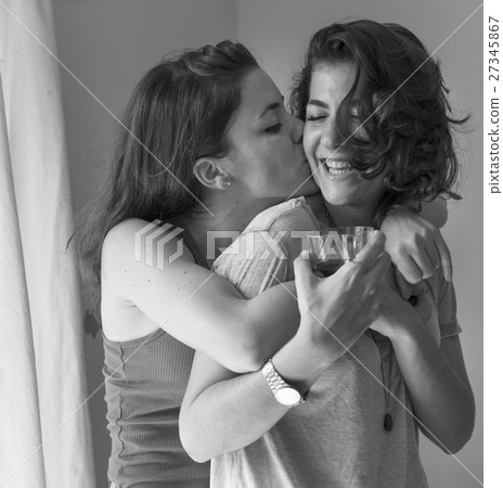 Lesbian Couple Together Indoors Concept Lesbian Couple Together Indoors Concept 27345867
