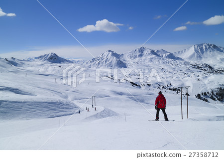 Snowboarding, skiing on fresh snow mountain slopes 27358712