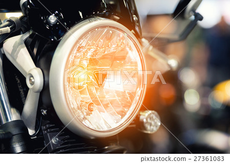 Modern motorcycle headlight with bokeh 27361083
