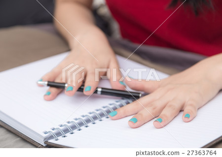 Women hand writing on blank notebook 27363764