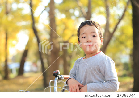 Children riding a bicycle 27365344