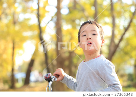 Children riding a bicycle 27365348