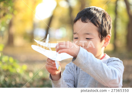 Children playing on paper airplanes 27365350