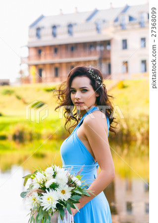 Beautiful young woman with curly hair Beautiful young woman with curly hair 27368099