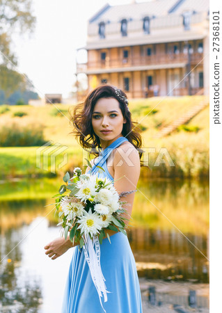 Beautiful young bridesmaid with curly hair 27368101