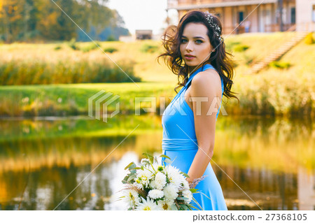Beautiful young bridesmaid with curly hair 27368105