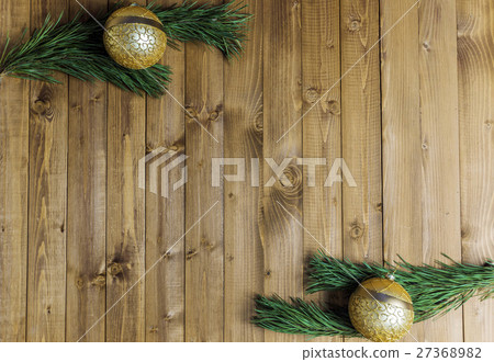 Christmas decored branches on wood background Christmas decored branches on wood background 27368982