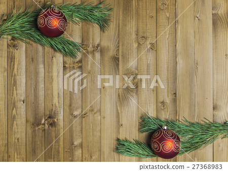 Christmas decored branches on wood background Christmas decored branches on wood background 27368983