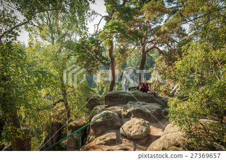 Young woman and her dog enjoy mountain hikes Young woman and her dog enjoy mountain hikes 27369657
