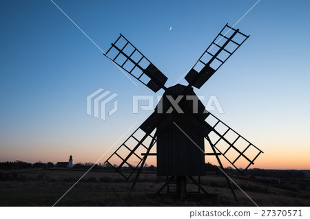 Traditional windmill and a church silhouettes 27370571