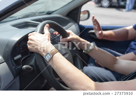 Senior learning to drive a car  27373910