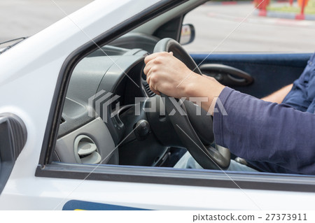Learner driver driving car with instructor 27373911