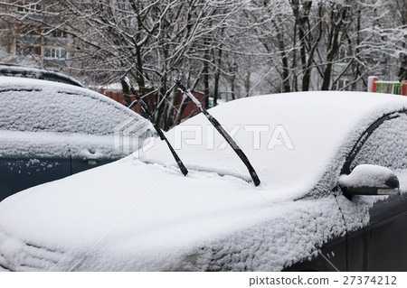 car in a winter morning with snow covered car in a winter morning with snow covered 27374212