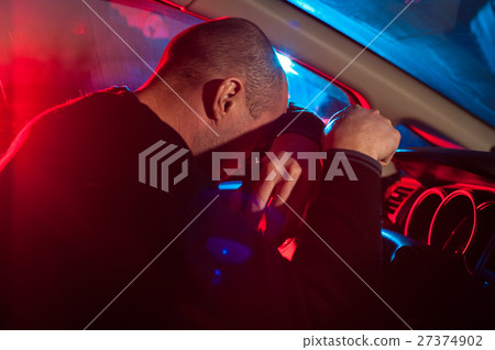 Drunk Man covering his face from police car light Drunk Man covering his face from police car light 27374902