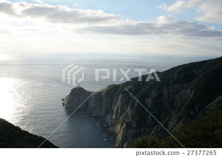 Ozose Saito lighthouse, which can be seen at the end of a steep cliff wall, perfect view of Fukue Island Osazaki Nagasaki prefecture, Japan Ozose Saito lighthouse, which can be seen at the end of a steep cliff wall, perfect view of Fukue Island Osazaki Nagasaki prefecture, Japan 27377265