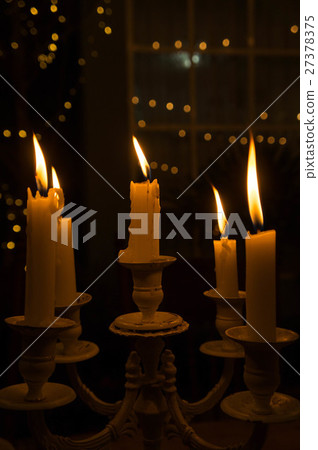 The light from the candle in the night 27378375