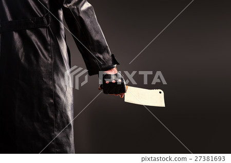 Killer holding meat cleaver in hand. Killer holding meat cleaver in hand. 27381693