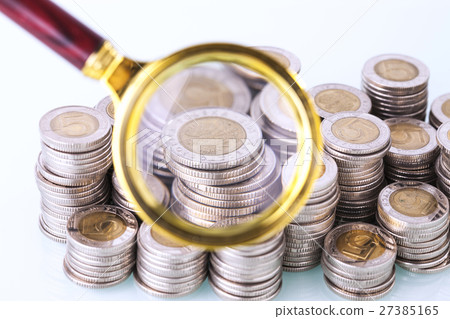 Money under loupe. Zoom on home finances 27385165