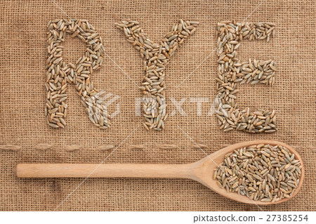 Inscription rye with a wooden spoon on burlap Inscription rye with a wooden spoon on burlap 27385254