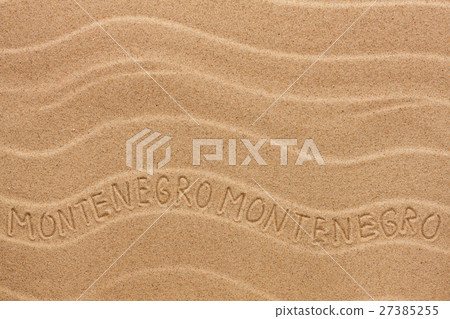 Montenegro inscription on the wavy sand 27385255