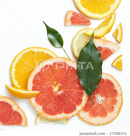 Fresh citrus fruits slices background viewed from 27386331