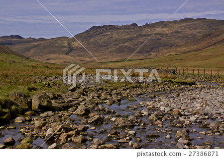 Stream in a valley 27386871