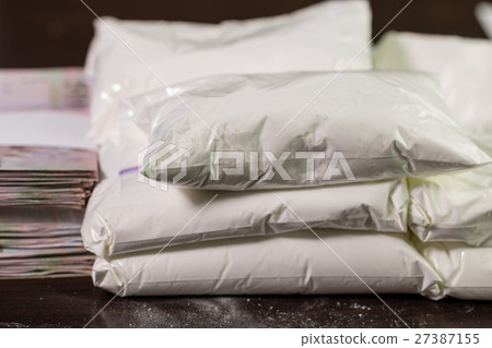 Bags of drugs, and money on table Bags of drugs, and money on table 27387155