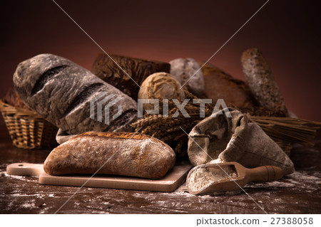 Fresh bread and wheat on the wooden table Fresh bread and wheat on the wooden table 27388058