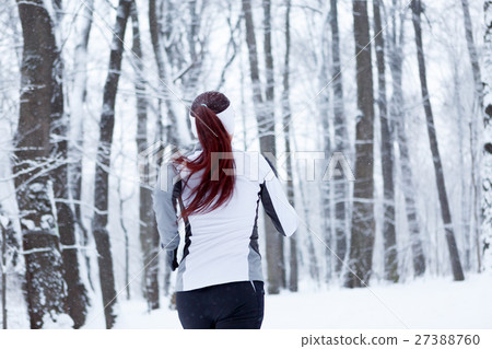 Young brunette in winter park 27388760