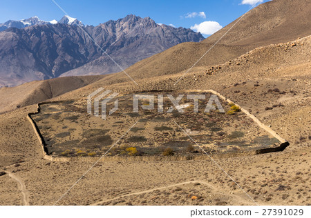 destroyed house enclosed by a stone wall destroyed house enclosed by a stone wall 27391029