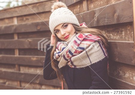 Pretty girl is wearing warm winter clothes 27391592