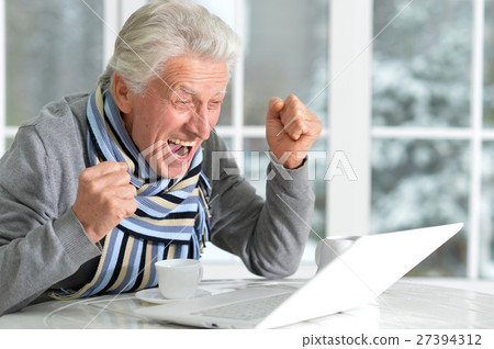 mature man sitting in cafe mature man sitting in cafe 27394312