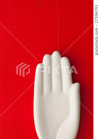 Detail of artifical hand on the wooden table Detail of artifical hand on the wooden table 27396701