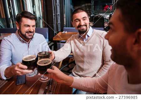 Delighted positive friends resting together Delighted positive friends resting together 27396985