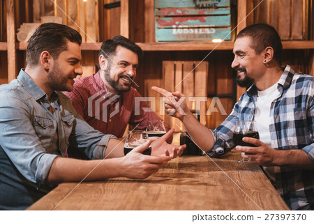 Cheerful positive men interacting with each other 27397370