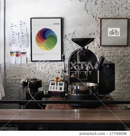 Coffee roaster with photo frames on the wall Coffee roaster with photo frames on the wall 27398696