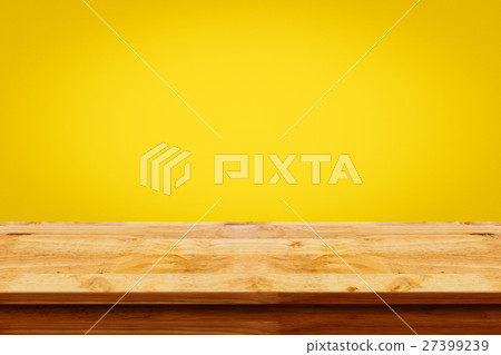 Empty of wooden table on yellow wall background. Empty of wooden table on yellow wall background. 27399239