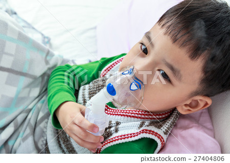 Top view of asian child holds a mask vapor inhaler 27404806