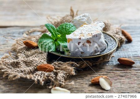 Sweet almond nougat with candied orange and mint. 27407966