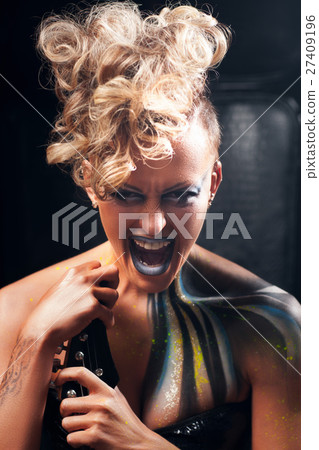 Aggressive punk woman screaming at camera Aggressive punk woman screaming at camera 27409196