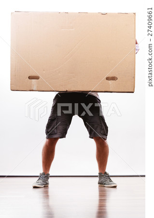 Delivery man holding a paper box. 27409661