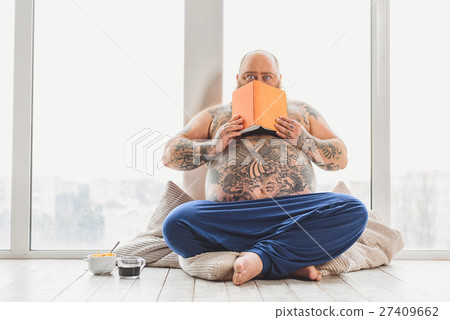 Shocked fat man has read something dreadful Shocked fat man has read something dreadful 27409662