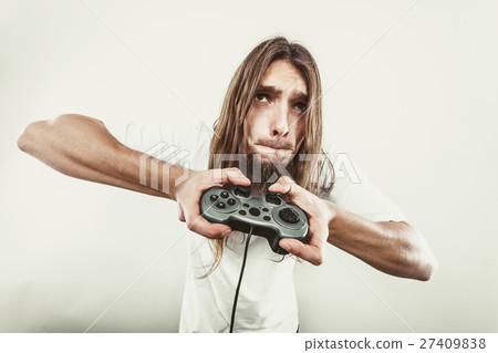Male player focus on play games 27409838