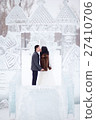 Winter wedding couple kissing in the middle of the 27410706