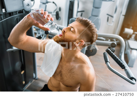 Sporty strong man in gym 27410750