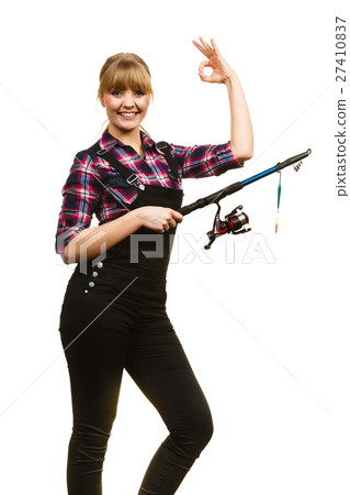Woman with fishing rod showing a ok 27410837