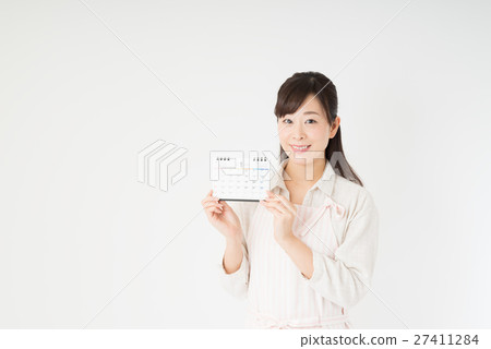A woman with a calendar A woman with a calendar 27411284