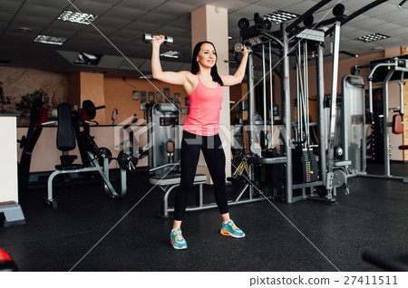 sexy girl engaged in fitness with dumbbells 27411511
