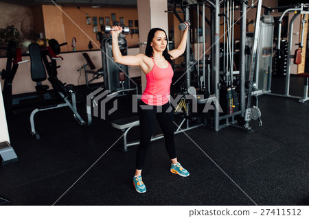 sexy girl engaged in fitness with dumbbells 27411512