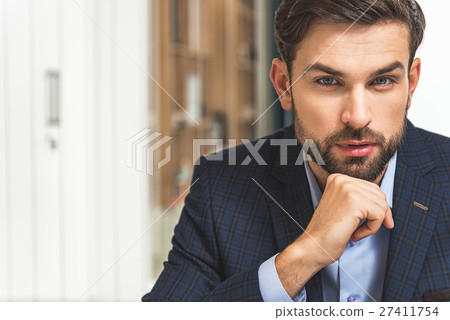 Confident businessman planning his work Confident businessman planning his work 27411754